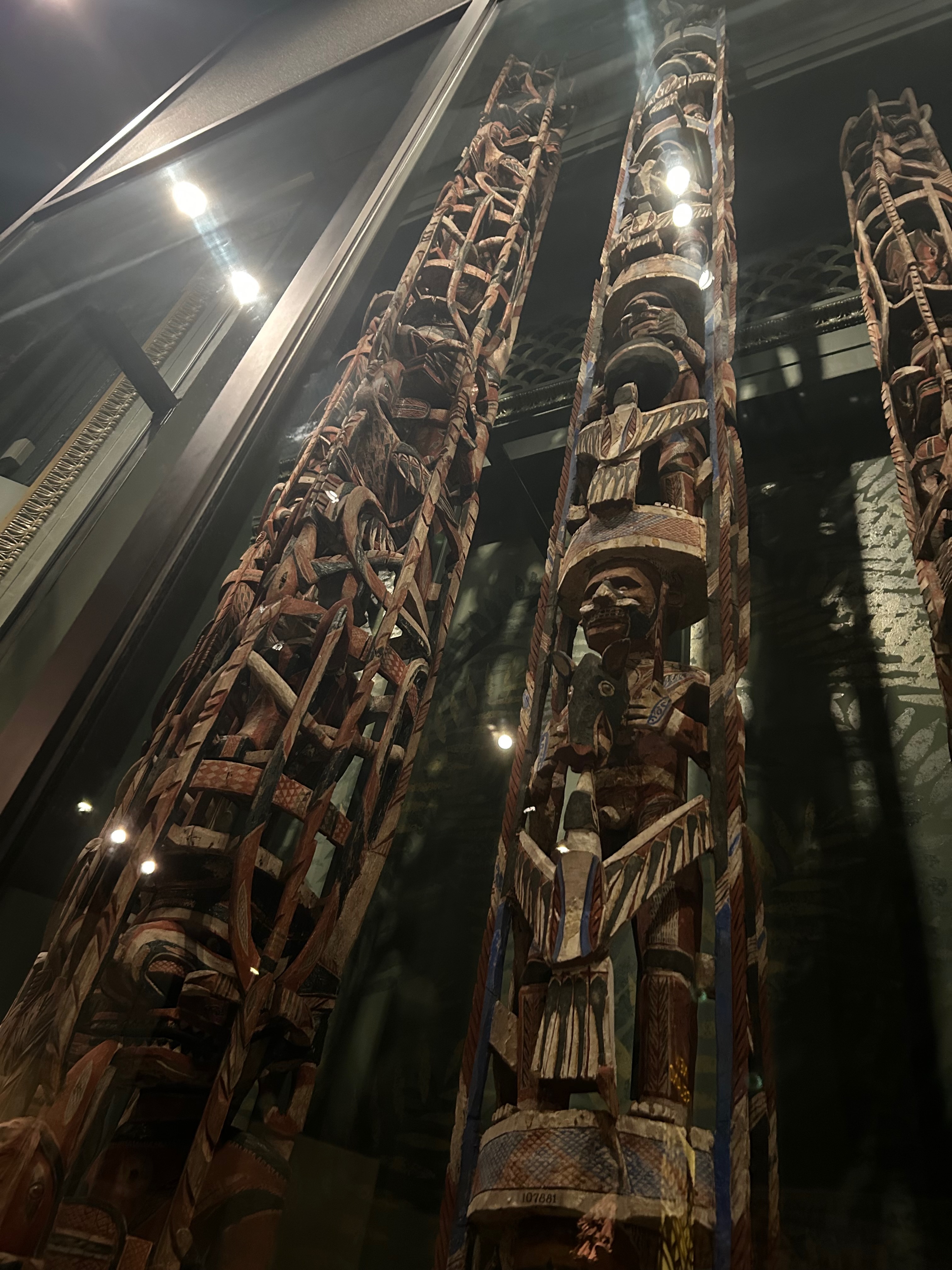 Totem poles extend to the top of the frame. Taken inside the Field Museum